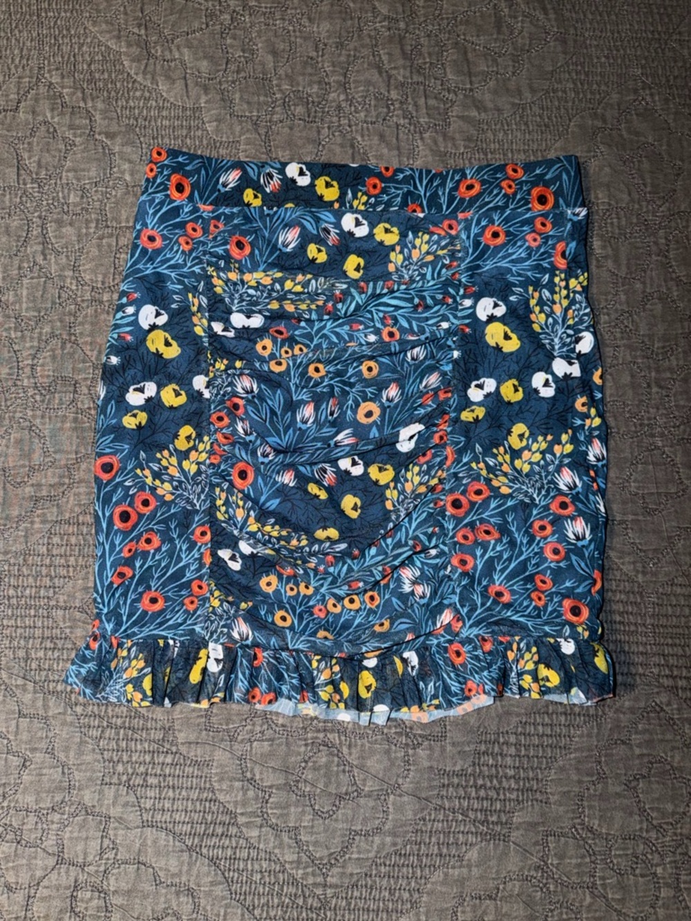 Free People Romi mesh mini skirt with a teal base with multicolored florals